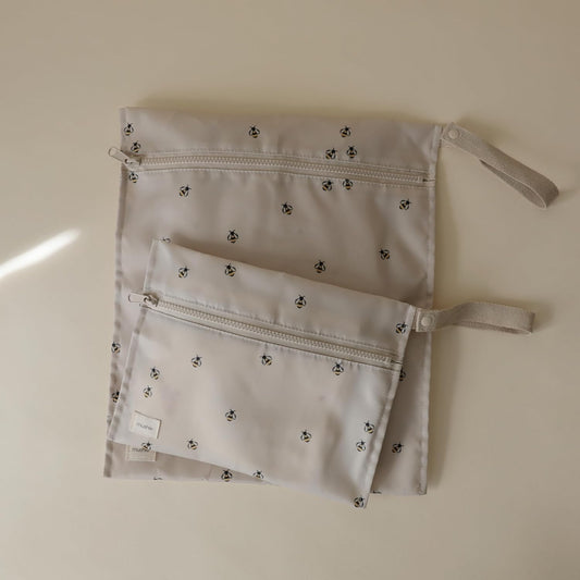 mushie Water Resistant Wet Bags | Large & Small Reusable Storage Bag for Baby Items and Travel | Zippered Pockets with Handle | Machine Washable, Set of 2 (Pastel Blooms)