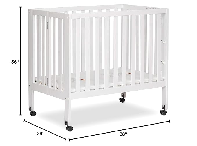 Dream On Me Jett Mini Folding Baby Crib in White, GreenGuard Gold & BSA, Lightweight & Portable, Patented Flat Folding System for Small Spaces & Travel, 1.5” Mattress Pad, 3 Heights, Safe Wheels