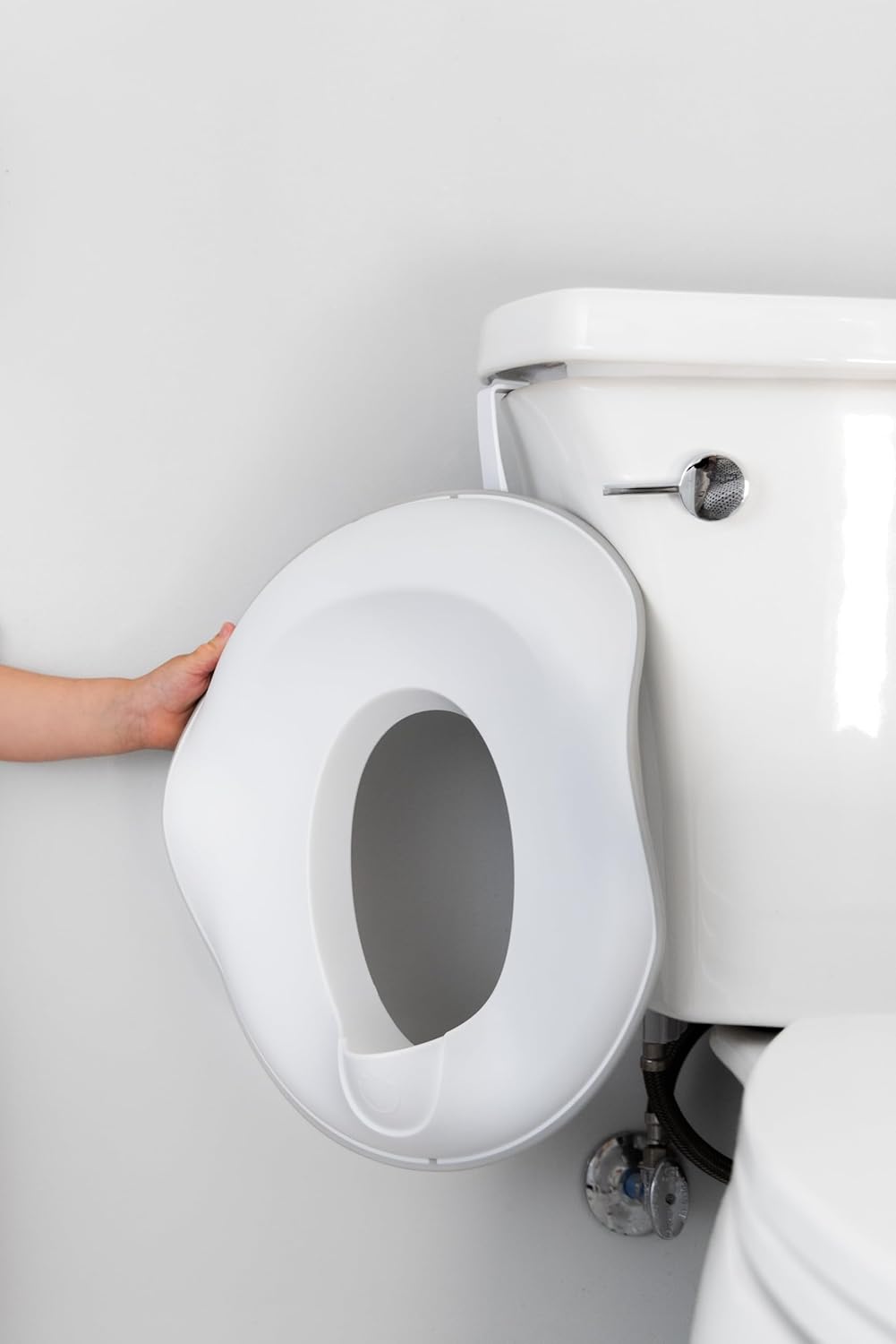 Ubbi Multi-Use Potty and Utility Hook, No Hardware Or Installation Needed, Durable and Sturdy to Hang Over Toilet Tank Or Door, Polypropylene, White