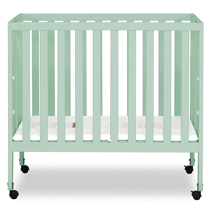 Dream On Me Jett Mini Folding Baby Crib in Mint, GreenGuard Gold & BSA, Lightweight & Portable, Patented Flat Folding System for Small Spaces & Travel, 1.5” Mattress Pad, 3 Heights, Safe Wheels