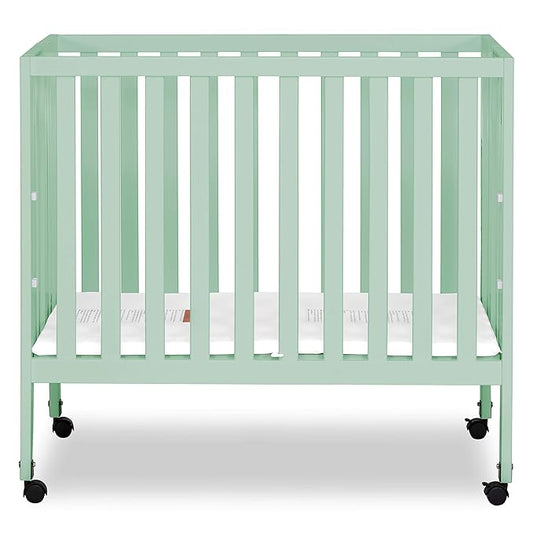 Dream On Me Jett Mini Folding Baby Crib in Mint, GreenGuard Gold & BSA, Lightweight & Portable, Patented Flat Folding System for Small Spaces & Travel, 1.5” Mattress Pad, 3 Heights, Safe Wheels