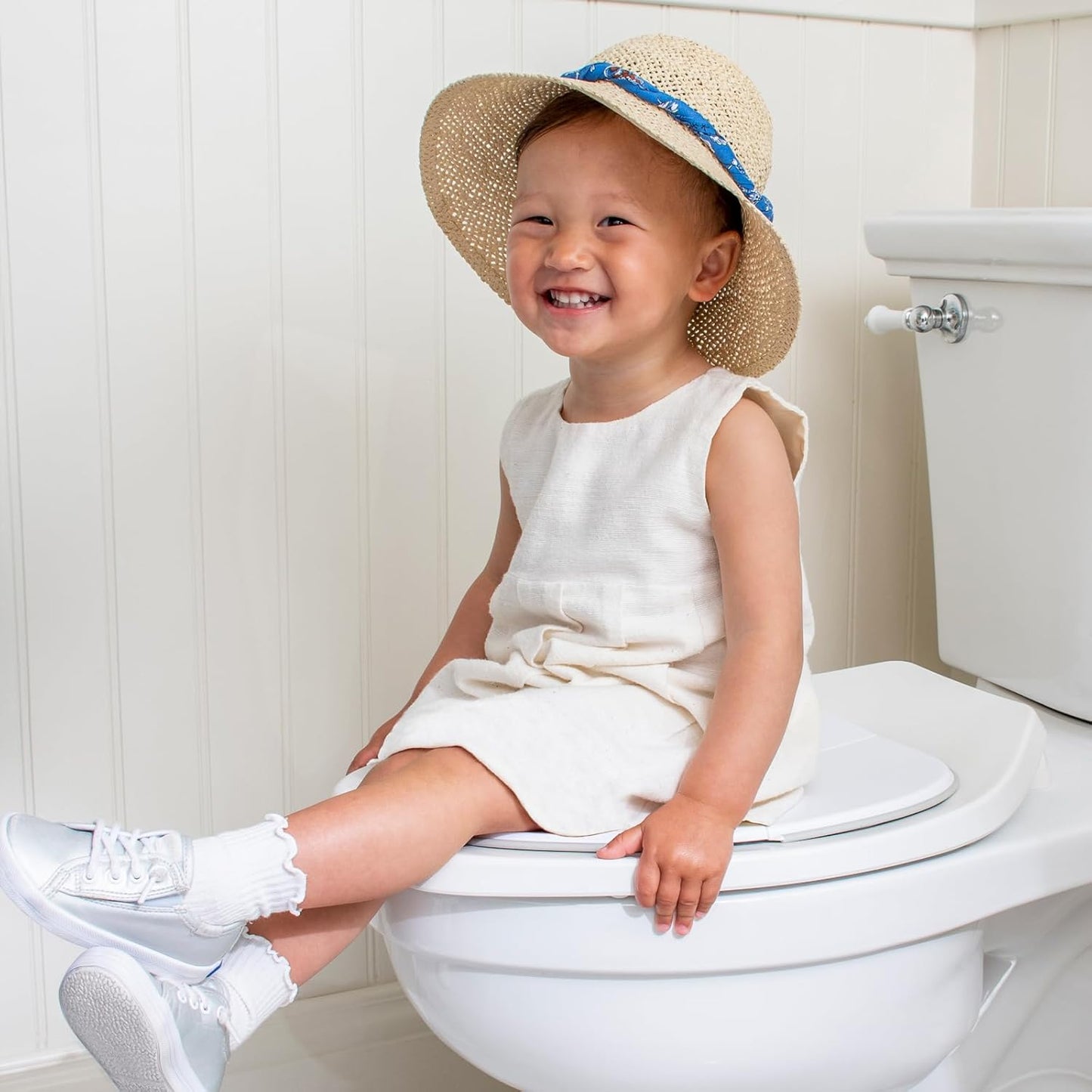 One Proud Toddler Premium Travel Potty Seat – Compact, Non-Slip, Made in USA Seat, No-Pinch Locking Hinges, Easy to Clean, Includes Machine-Washable Carry Bag