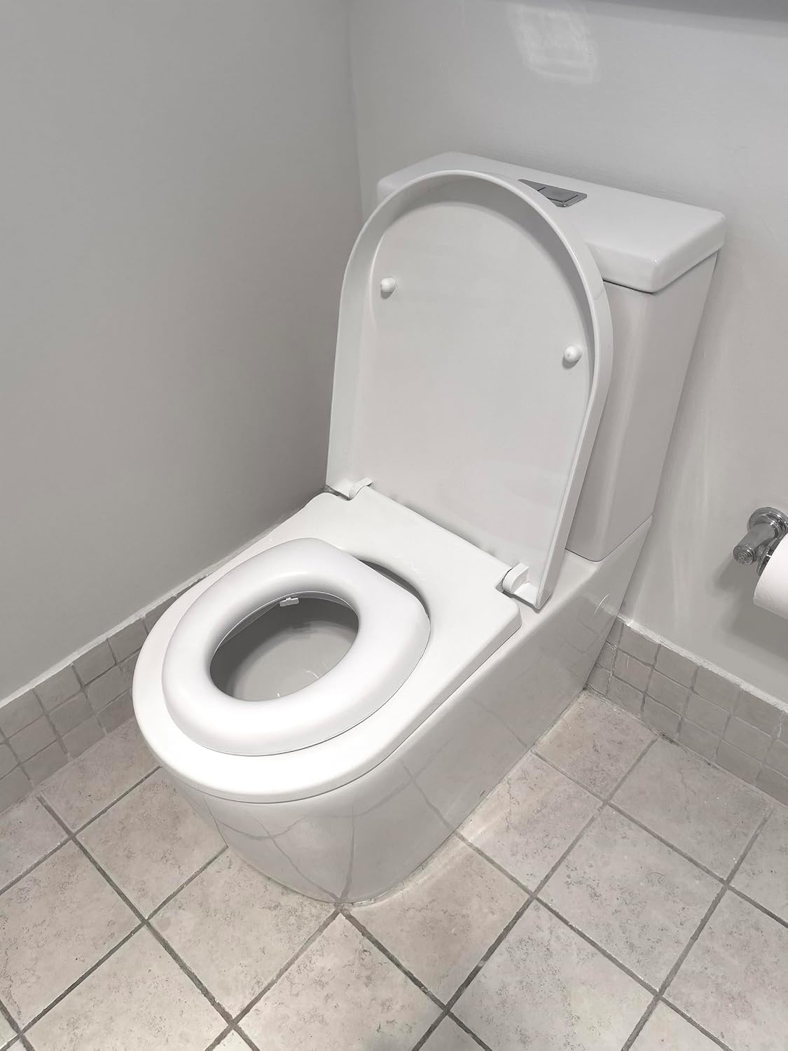 Dreambaby Soft Touch Potty Seat - Comfortable Padded Seat - With High Base Underneath for Secure Positioning - Fit Most Standard Toilets - White - Model L604