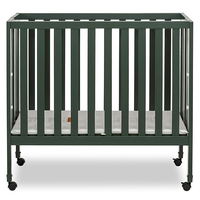 Dream On Me Jett Mini Folding Baby Crib in Olive, GreenGuard Gold & BSA, Lightweight & Portable, Patented Flat Folding System for Small Spaces & Travel, 1.5” Mattress Pad, 3 Heights, Safe Wheels