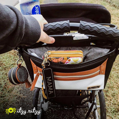Itzy Ritzy Adjustable Stroller Caddy and Organizer Bag Featuring Front Zippered Pocket, 2 Built-In Interior Pockets & Adjustable Straps to Fit Nearly Any Stroller (Coffee and Cream)