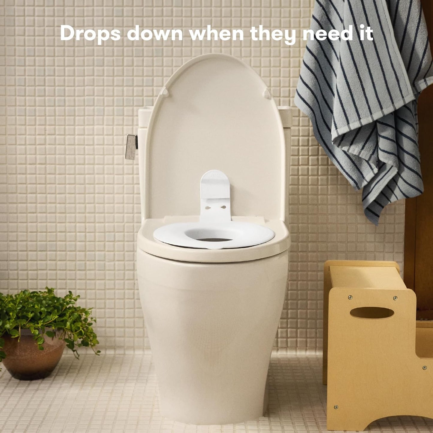 Frida Baby Drop Down Potty Seat, Potty Training Seat for Toddlers, Attaches Securely to Adult Toilet, Flips Up or Stays Down for Kid Ready Access, Easy to Clean, Secure, Stable & Easy to Install