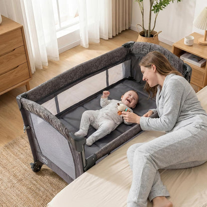 HONEY JOY Baby Bedside Sleeper, 6-in-1 Pack and Play w/Infant Bassinet, Diaper Changing Table & Portable Play Yard, 3 Adjustable Heights, Music Box & Side Storage Bag, Carry Bag(Black)