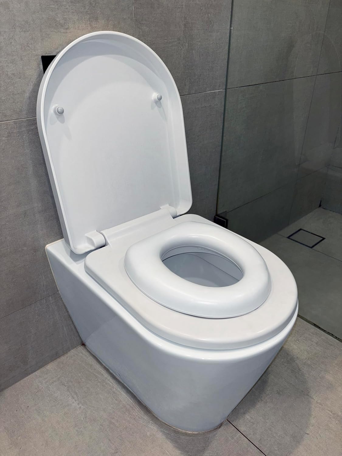 Dreambaby Soft Touch Potty Seat - Comfortable Padded Seat - With High Base Underneath for Secure Positioning - Fit Most Standard Toilets - White - Model L604
