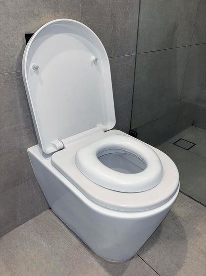 Dreambaby Soft Touch Potty Seat - Comfortable Padded Seat - With High Base Underneath for Secure Positioning - Fit Most Standard Toilets - White - Model L604