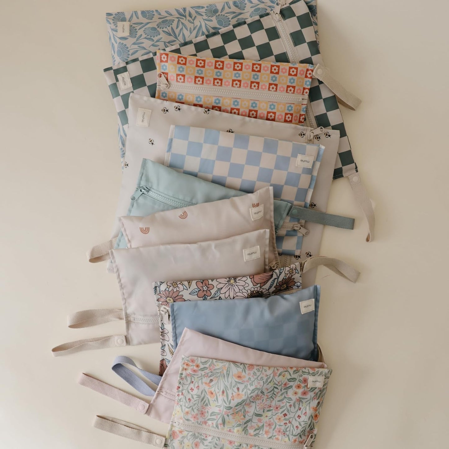 mushie Water Resistant Wet Bags | Large & Small Reusable Storage Bag for Baby Items and Travel | Zippered Pockets with Handle | Machine Washable, Set of 2 (Pastel Blooms)