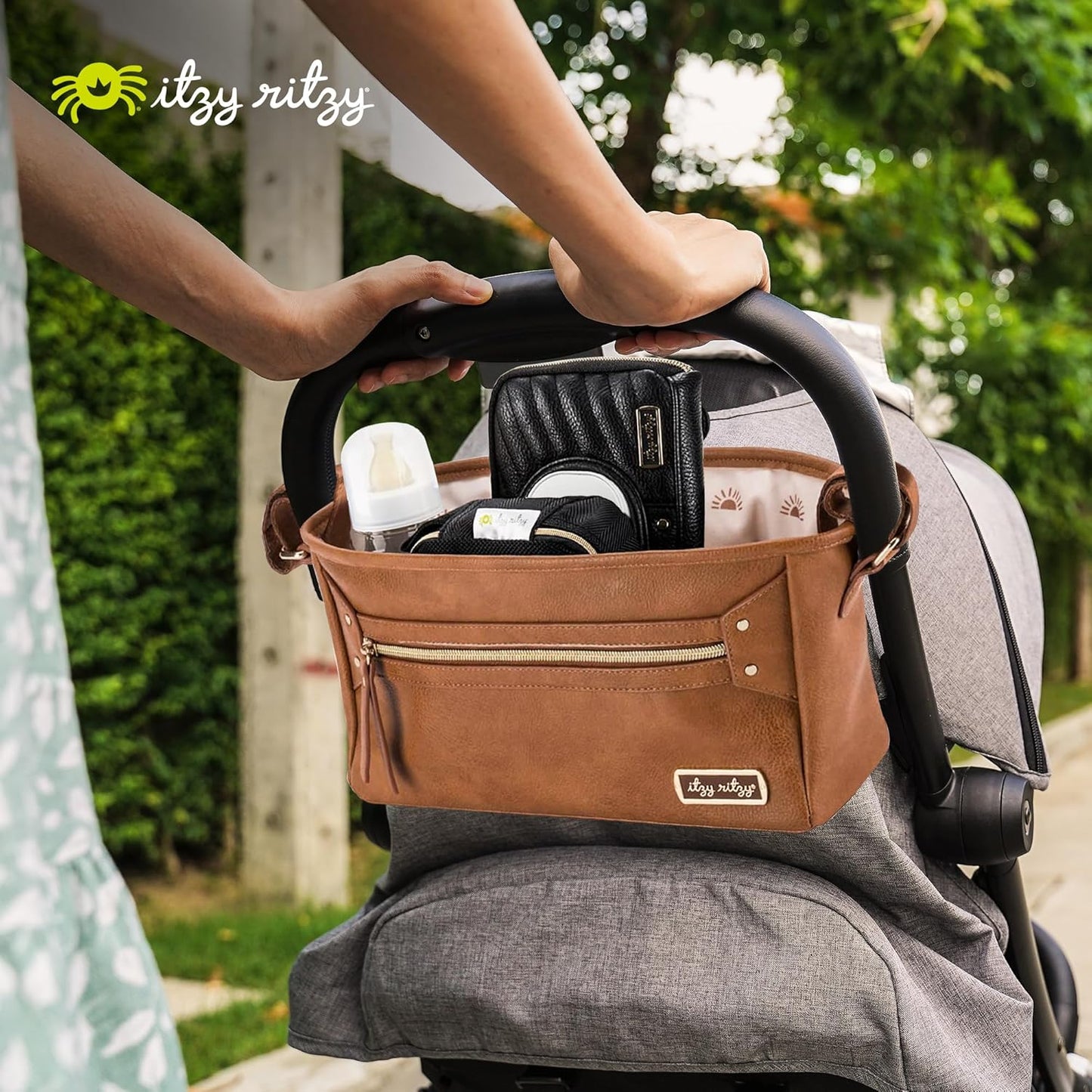 Itzy Ritzy Adjustable Stroller Caddy and Organizer Bag Featuring Front Zippered Pocket, 2 Built-In Interior Pockets & Adjustable Straps to Fit Nearly Any Stroller (Coffee and Cream)
