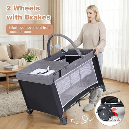BABY JOY 3 in 1 Pack and Play, Travel Crib Bassinet Bed for Baby, Changing Table w/Safety Belt, Toy Bar, Lockable Wheels, Portable Baby Playard from Newborn to Toddler