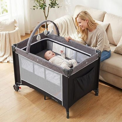 BABY JOY 3 in 1 Pack and Play, Travel Crib Bassinet Bed for Baby, Changing Table w/Safety Belt, Toy Bar, Lockable Wheels, Portable Baby Playard from Newborn to Toddler