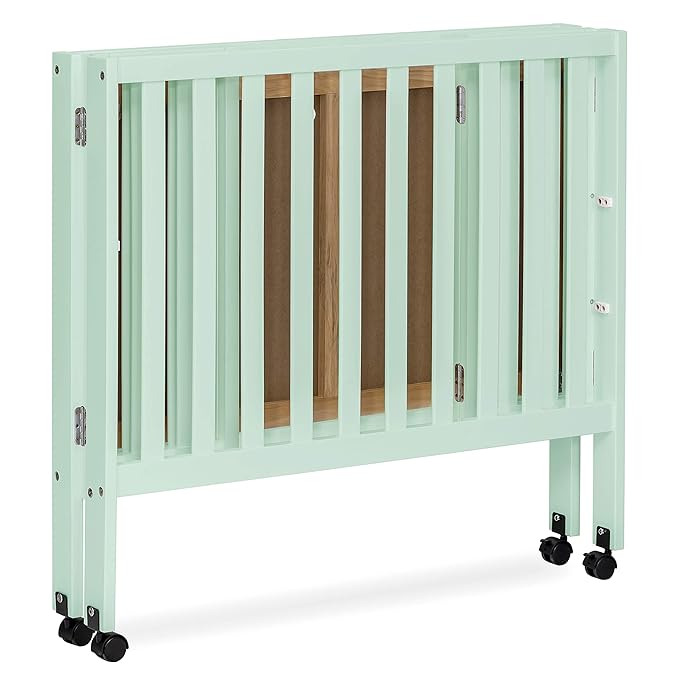 Dream On Me Jett Mini Folding Baby Crib in Mint, GreenGuard Gold & BSA, Lightweight & Portable, Patented Flat Folding System for Small Spaces & Travel, 1.5” Mattress Pad, 3 Heights, Safe Wheels