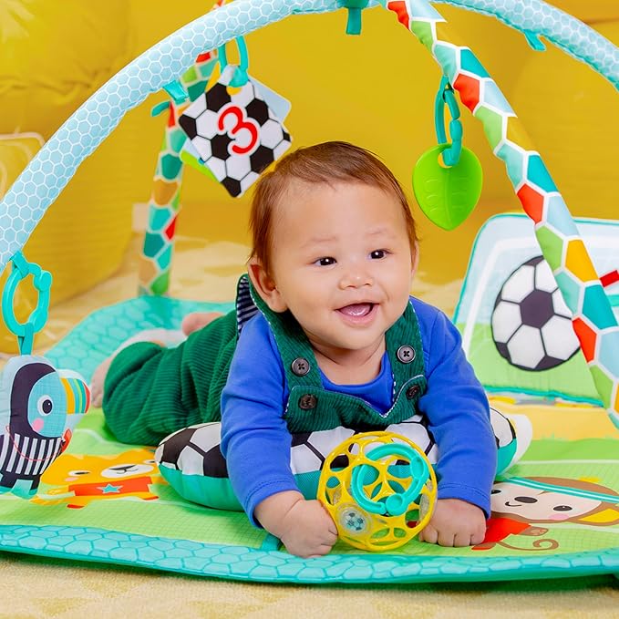 Bright Starts Grip & Kick Oball Activity Gym, Soccer Theme with Easy-Grasp Baby Toys, Baby Play Gym, Kick Pad with Activated Lights & Tummy Time Pillow, Unisex, Newborn+