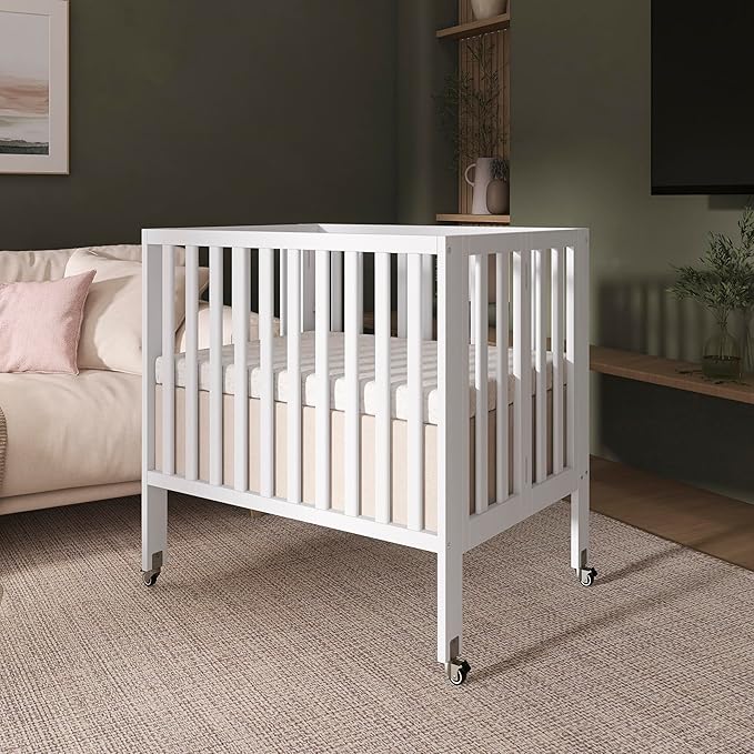 Dream On Me Jett Mini Folding Baby Crib in White, GreenGuard Gold & BSA, Lightweight & Portable, Patented Flat Folding System for Small Spaces & Travel, 1.5” Mattress Pad, 3 Heights, Safe Wheels