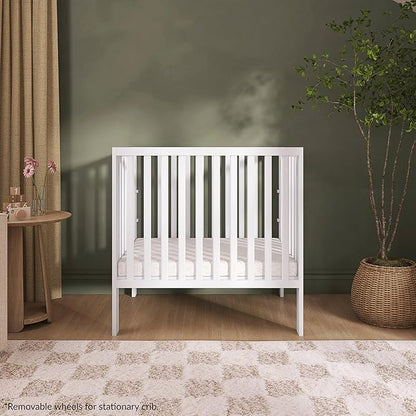 Dream On Me Jett Mini Folding Baby Crib in White, GreenGuard Gold & BSA, Lightweight & Portable, Patented Flat Folding System for Small Spaces & Travel, 1.5” Mattress Pad, 3 Heights, Safe Wheels