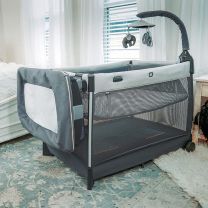 Chicco Lullaby Zip All-in-One Portable Playard, Infant Bassinet and Changer, Electronic Toy Bar, Toddler Playard, Travel Friendly | Driftwood/Grey