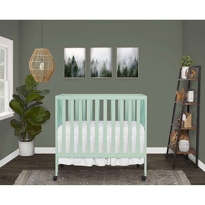 Dream On Me Jett Mini Folding Baby Crib in Mint, GreenGuard Gold & BSA, Lightweight & Portable, Patented Flat Folding System for Small Spaces & Travel, 1.5” Mattress Pad, 3 Heights, Safe Wheels