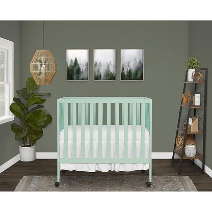 Dream On Me Jett Mini Folding Baby Crib in Mint, GreenGuard Gold & BSA, Lightweight & Portable, Patented Flat Folding System for Small Spaces & Travel, 1.5” Mattress Pad, 3 Heights, Safe Wheels