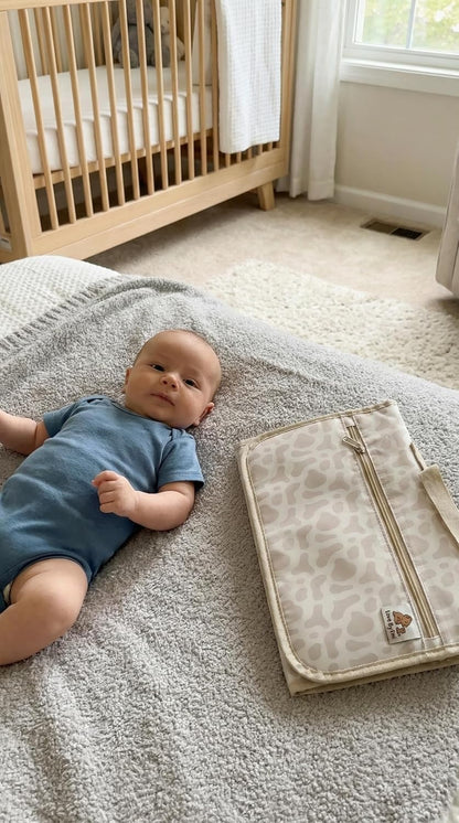Love By Emi Portable Diaper Changing Pad, A Waterproof Travel Station and Foldable Clutch with Storage Pockets, an On-The-Go Baby Essential for Newborns and Toddlers with Cute Animals Pattern (Brown)