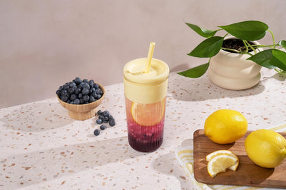 Devon Glass Tumbler , Protective No Sweat Silicone Sleeve and Splash Proof Wooden Detail Lid with Straw, 18 oz | Glass smoothie cup with friction-fit lid. BPA-free, great for iced coffee, tea, and cold drinks.