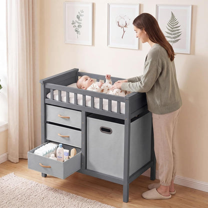 Wooden Baby Changing Table with Comfy Changing Pad, 3 Fabric Drawers, Laundry Hamper, Safety Belt, Diaper Station Dresser for Nursery Infant (White)