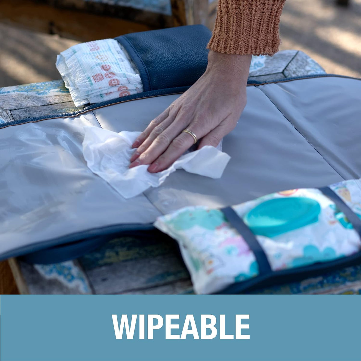 Portable Baby Changing Pad Clutch with Wristlet - Premium Foldable Water Resistant Diaper Changing Mat with Storage Pockets for Diapers and Wipes - Brown
